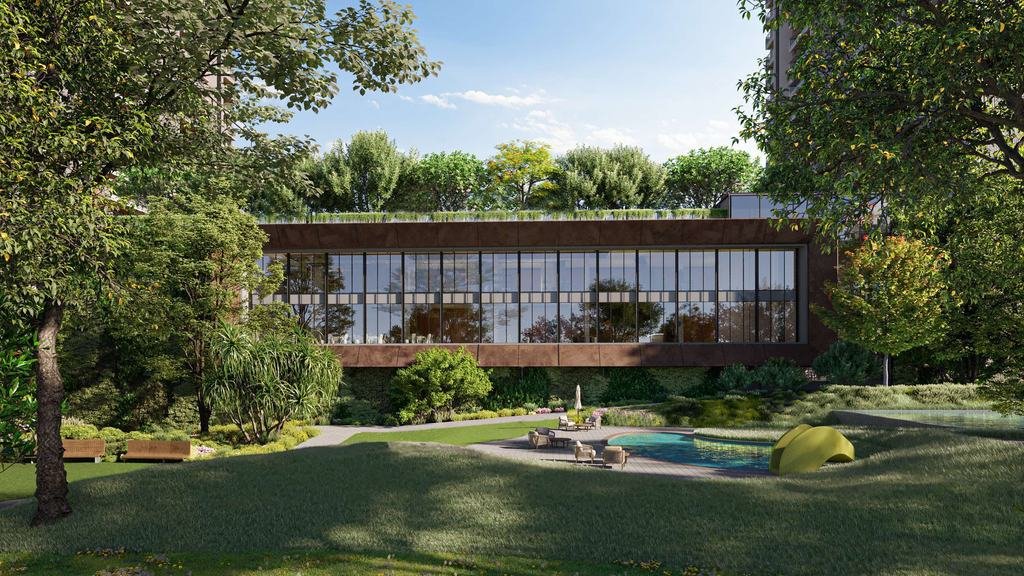 Clubhouse pavilion beyond rolling English-style lawns and mature trees