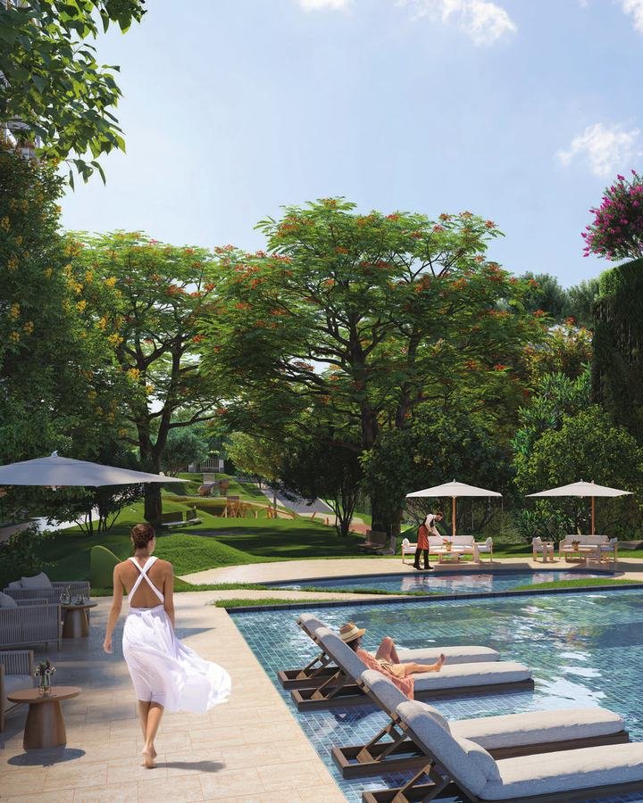 Lodha Camelot clubhouse and pool set within landscaped gardens